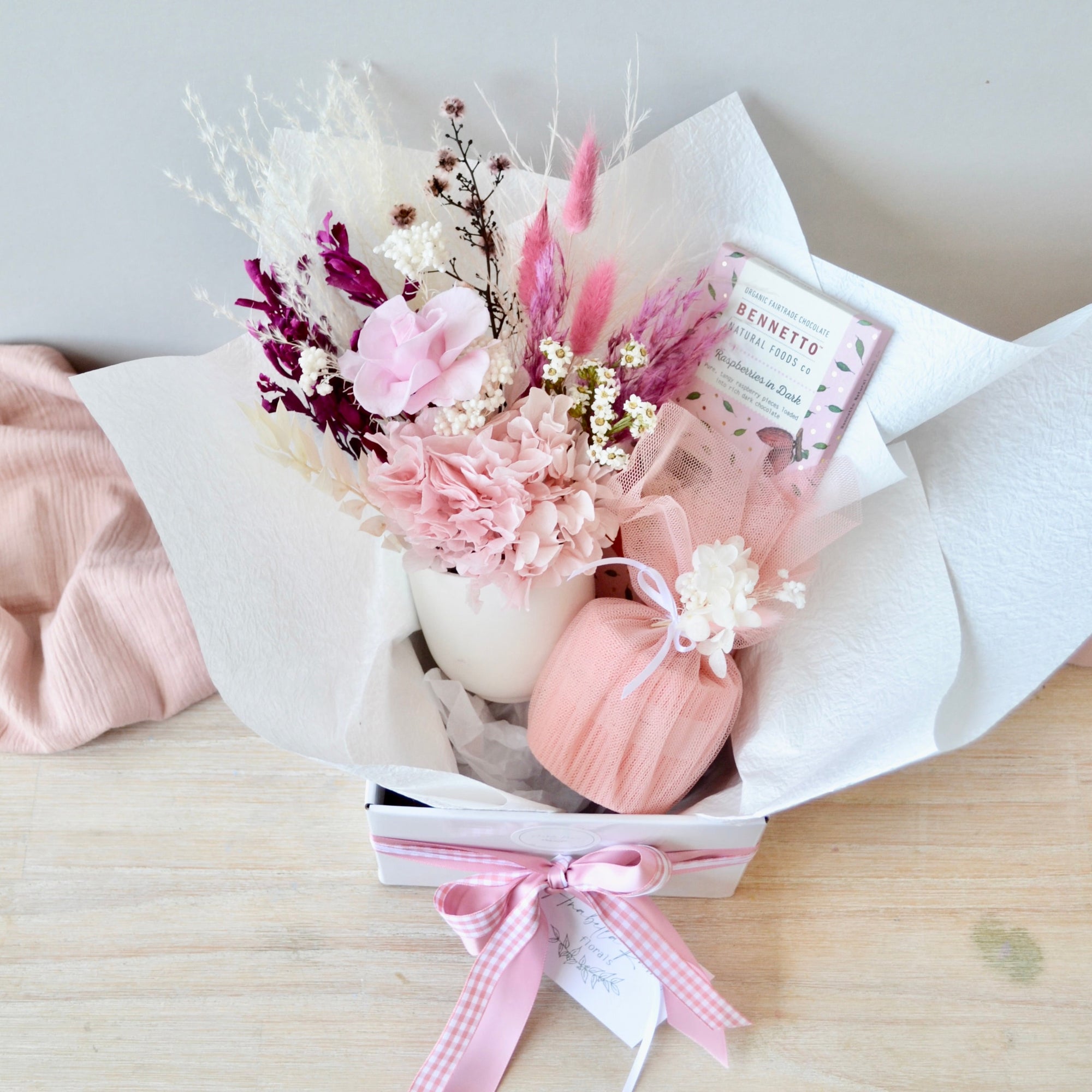 pink dried flower, candle and chocolate hamper
